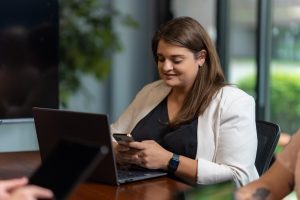 Sarah with a Laptop and Phone